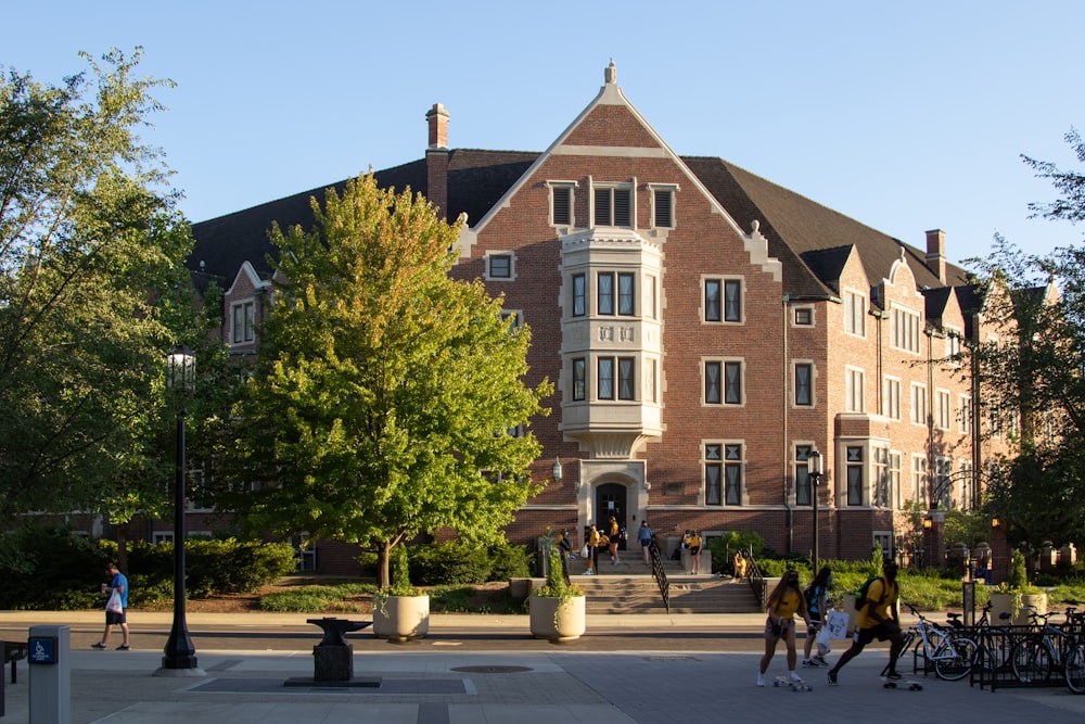 people walking on street near brown concrete building during daytime