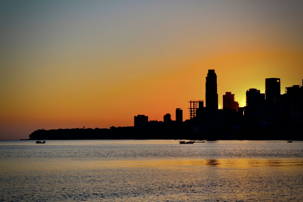 silhouette of city skyline during sunset