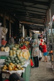 Vibrant market scene in the Philippines with fresh tropical fruits and lively vendors.