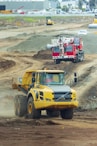 yellow and red truck on brown sand