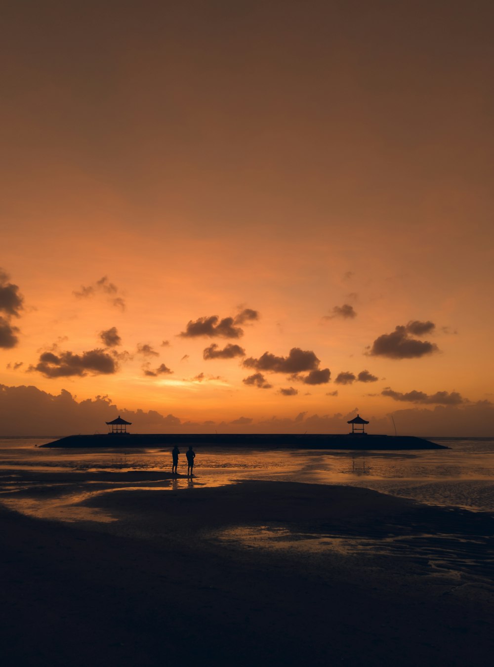 silhouette of people on beach during daytime