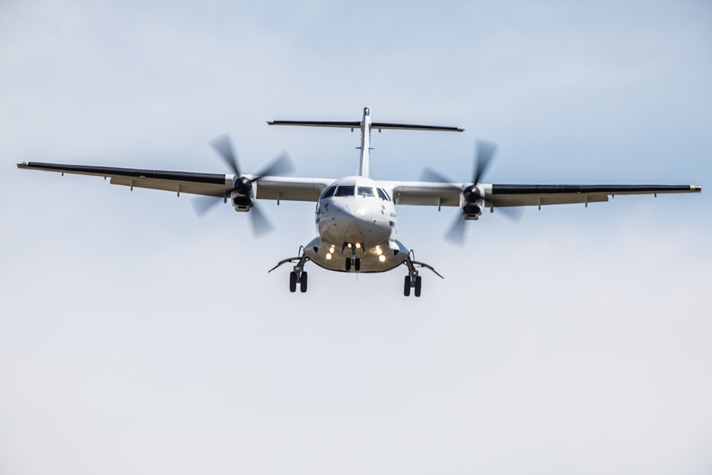 black and yellow fighter plane in mid air