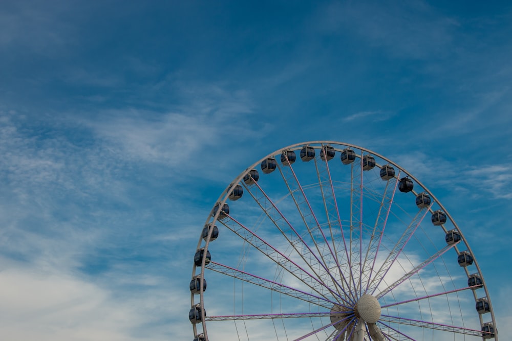 white ferris wheel under blue sky during daytime