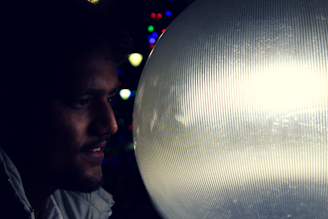 An astrologer examining a glowing astrology chart under soft, warm lighting.