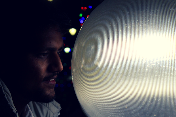 An astrologer examining a glowing astrology chart under soft, warm lighting.