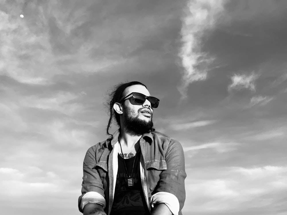 grayscale photo of man wearing sunglasses and jacket