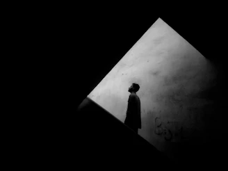 silhouette of person standing on white printer paper