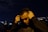 man in black hoodie holding his face