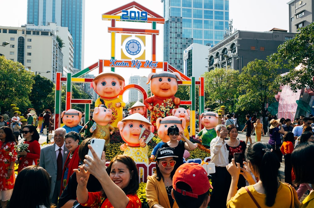 a group of people standing in front of a clock tower