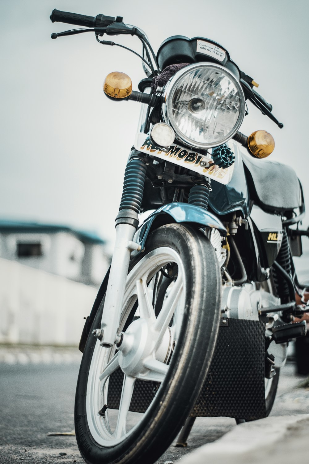 green and black motorcycle on road during daytime