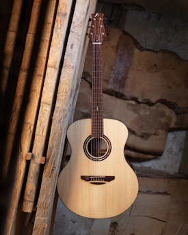 A vibrant acoustic guitar set against a rustic backdrop, symbolizing modern americana music.