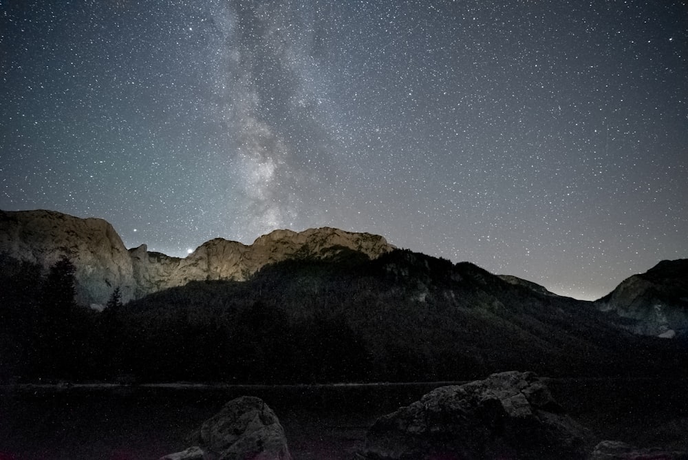 mountain range under starry night