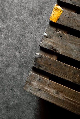 brown wooden pallet on gray concrete floor