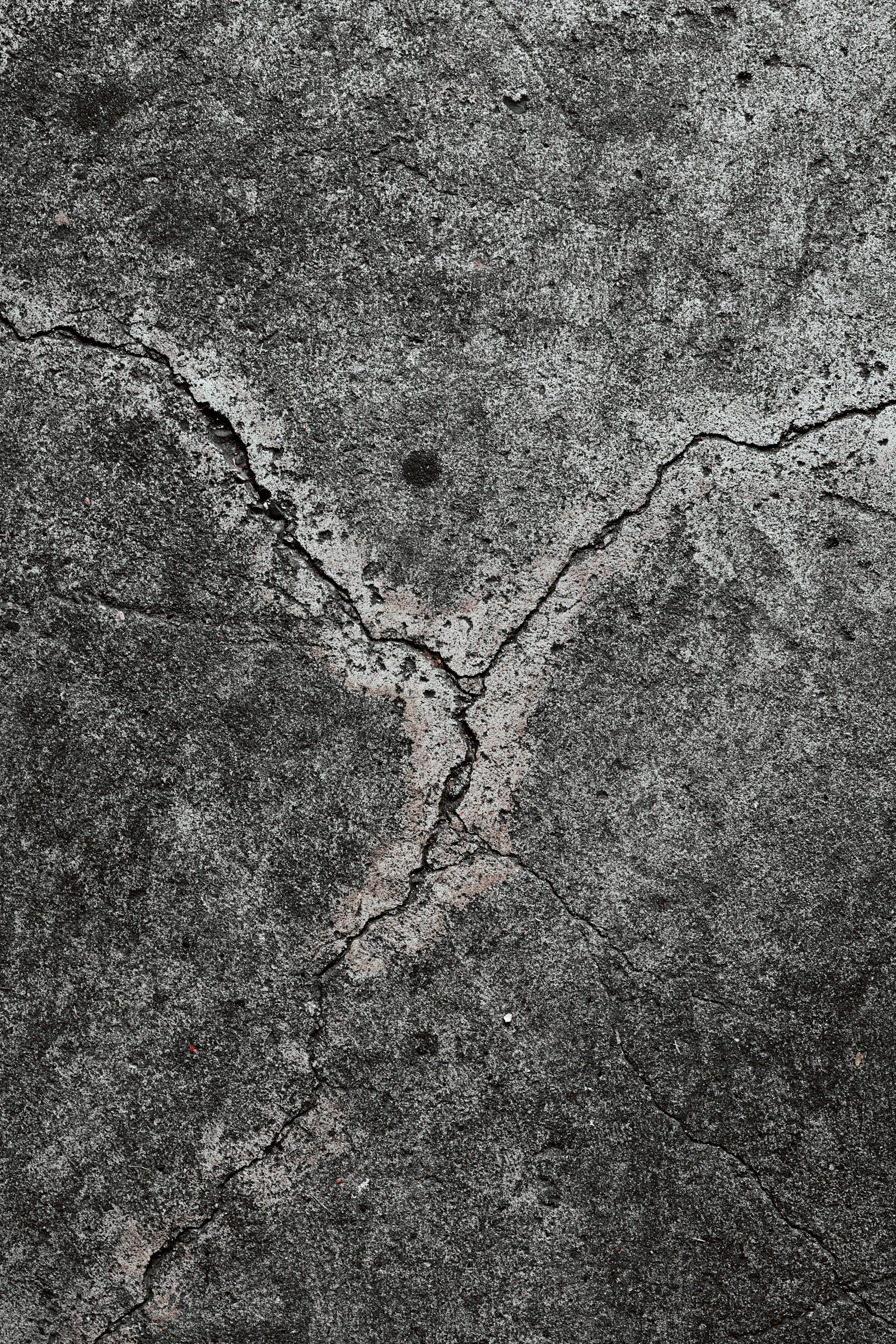 damaged peeling concrete garage floor in Toronto needing epoxy resurfacing