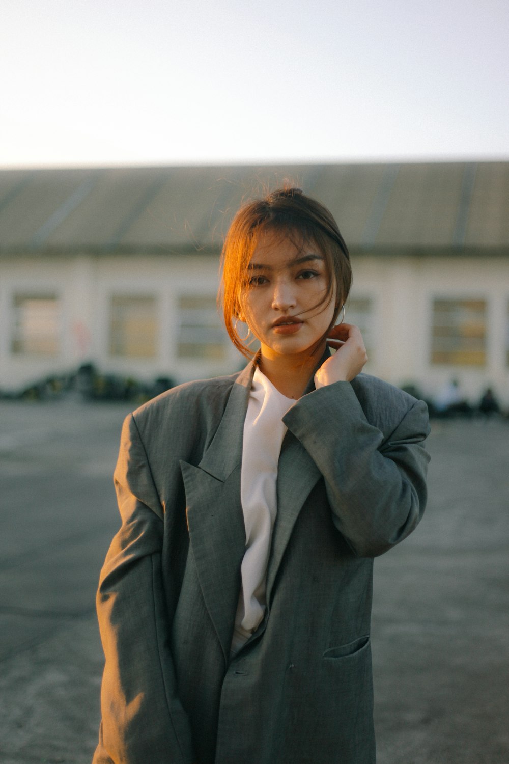 woman in gray blazer smiling