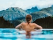 woman in blue swimming pool during daytime