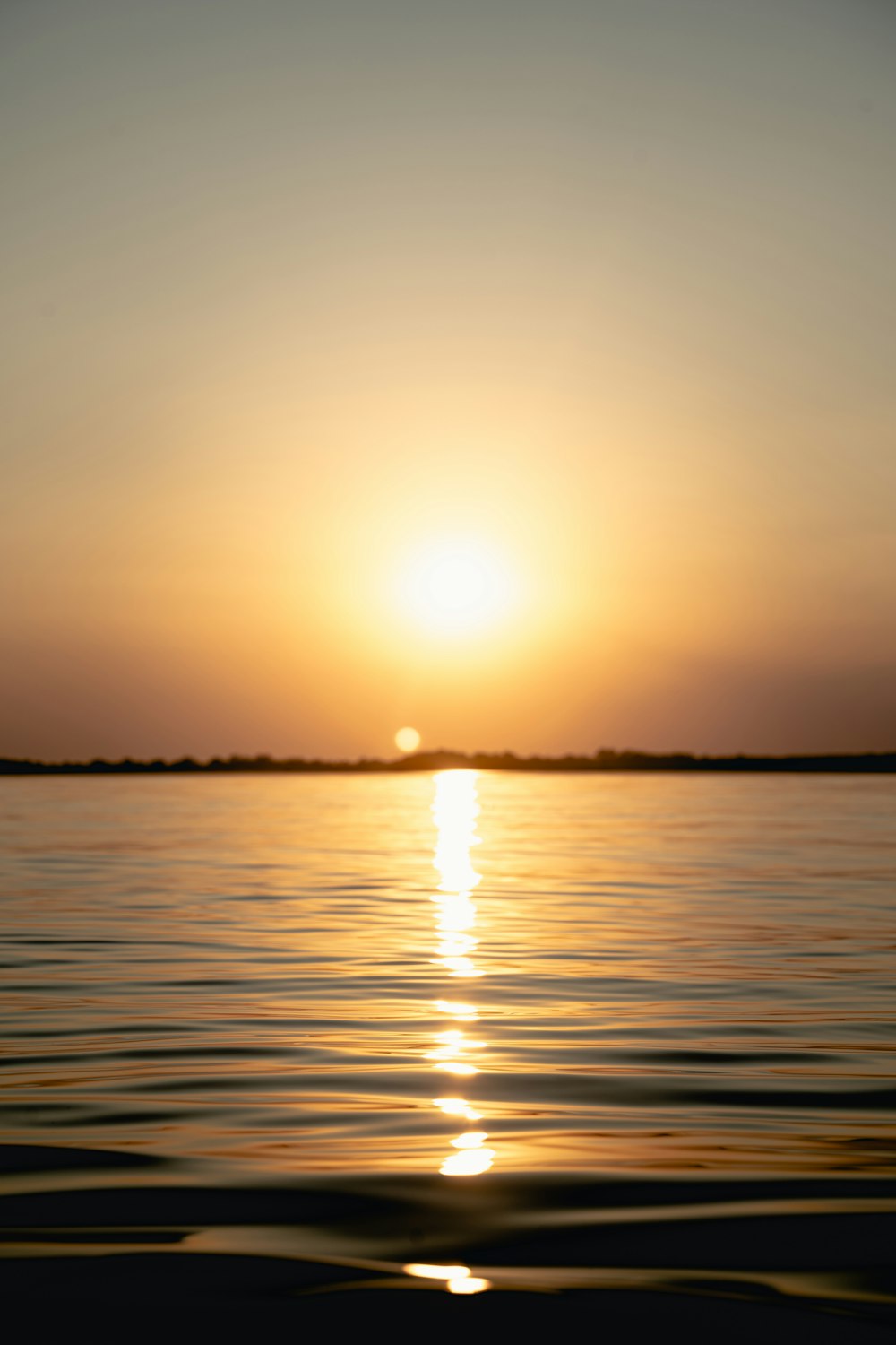 body of water during sunset