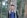 man in blue and white polo shirt standing beside tree