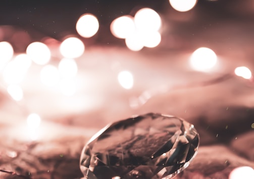 clear glass ball on brown wooden surface