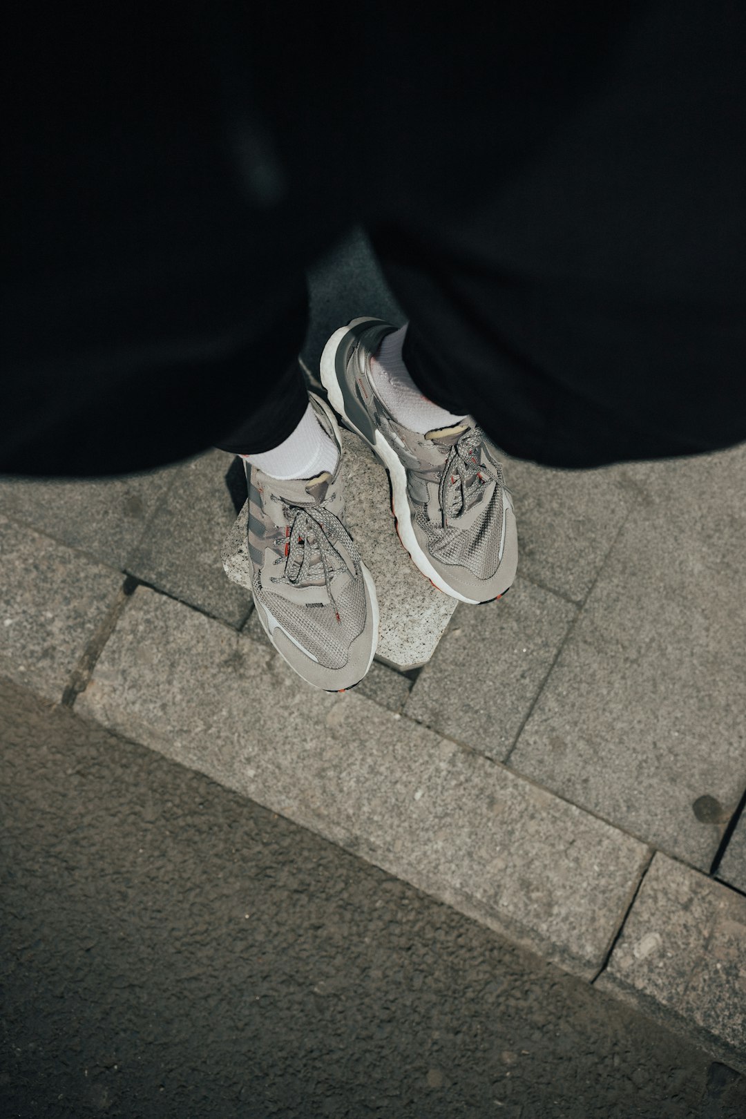 person wearing gray and white running shoes