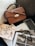 brown leather handbag beside macbook pro