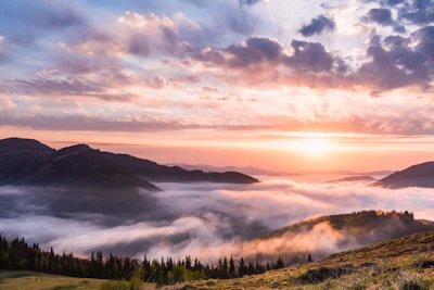 Wide shot of a traditional Andean mountain landscape at sunrise.