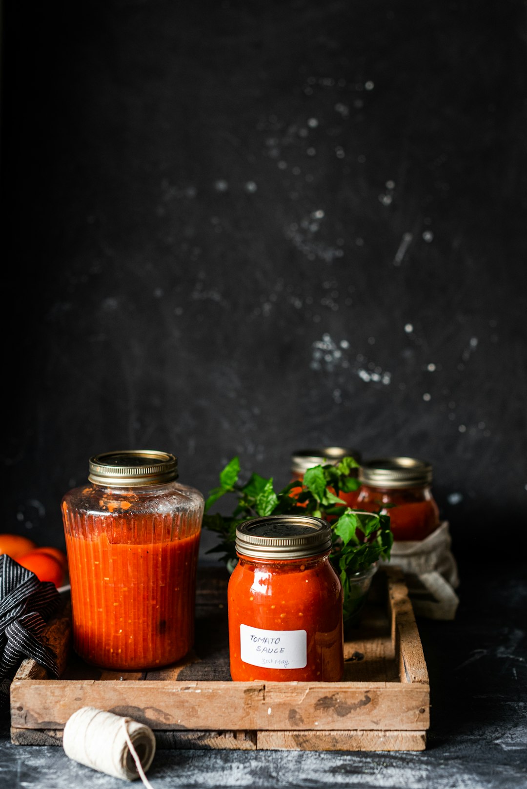 three clear glass jars on brown wooden table