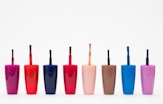 eight assorted color glass bottles