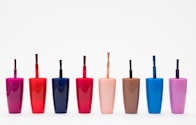 eight assorted color glass bottles
