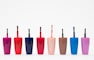 eight assorted color glass bottles