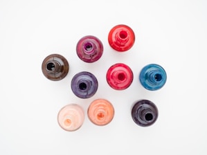 eight round pink blue and orange plastic cups