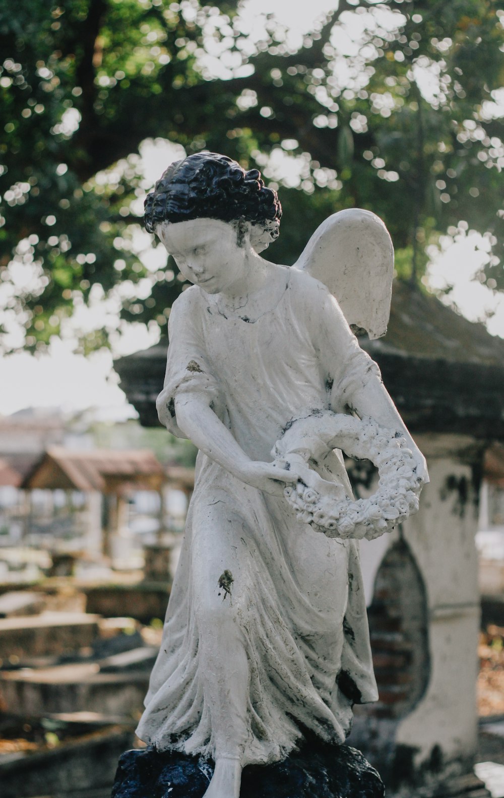 white concrete statue of a man