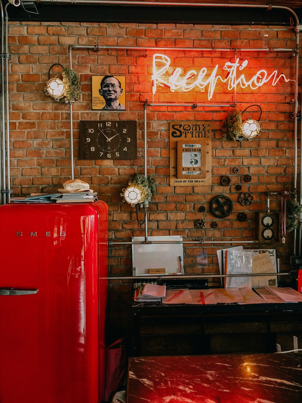 red top mount refrigerator beside brown wooden table