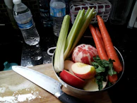 A clean, organized preparation area with cutting boards, blenders, and fresh produce ready for use.
