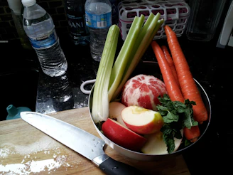 A clean, organized preparation area with cutting boards, blenders, and fresh produce ready for use.