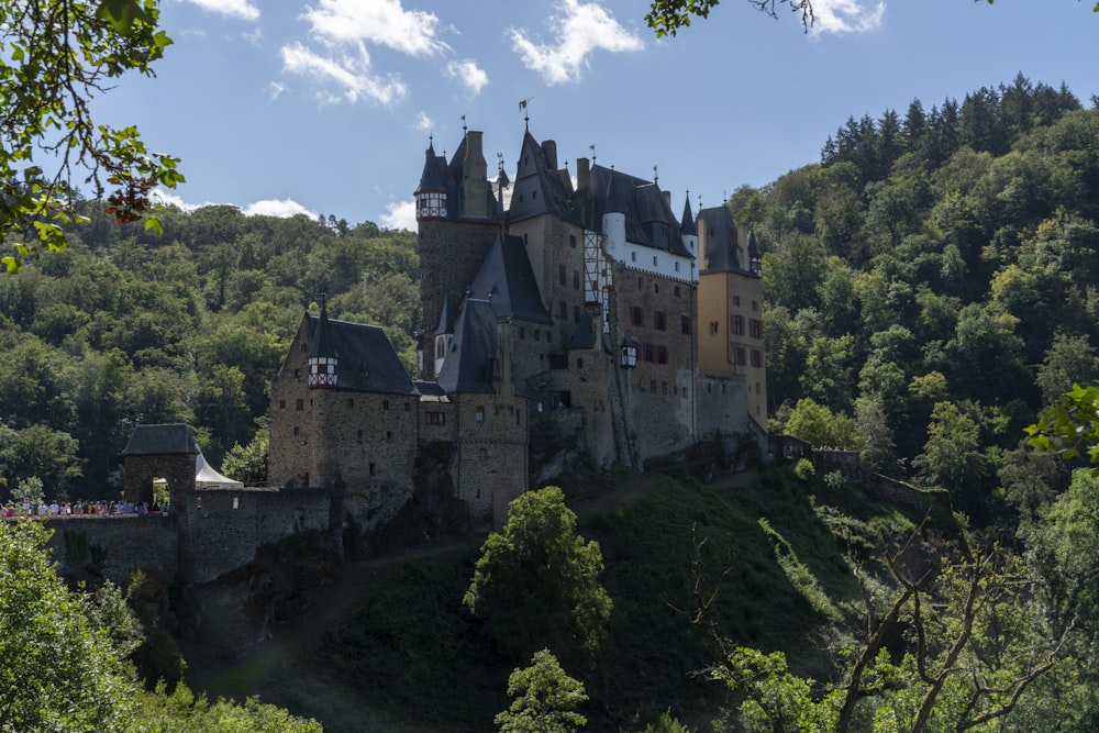 grey concrete castle on top of hill