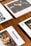 Several lifestyle magazines are arranged on a wooden table. The publications have vibrant covers, including one with the title 'Banyan' and an image of a woman wearing sunglasses and stylish earrings. The photographed magazines are placed in a neat, overlapping pattern.