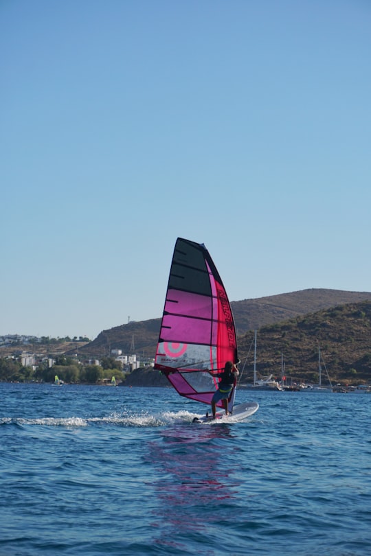 red and black sailboat on sea during daytime in Bodrum Turkey