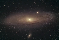 A stunning image of a spiral galaxy glowing with bright stars and cosmic dust.