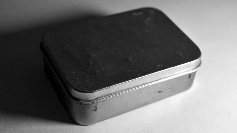 black and gray plastic container