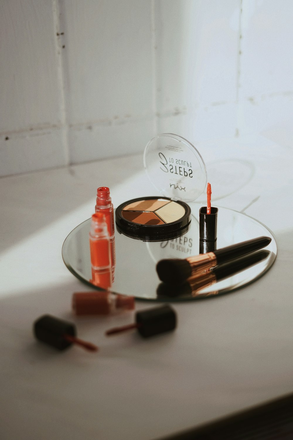 red lipstick on white table