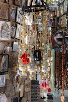 Various spiritual items including beads and charms displayed on a cloth.