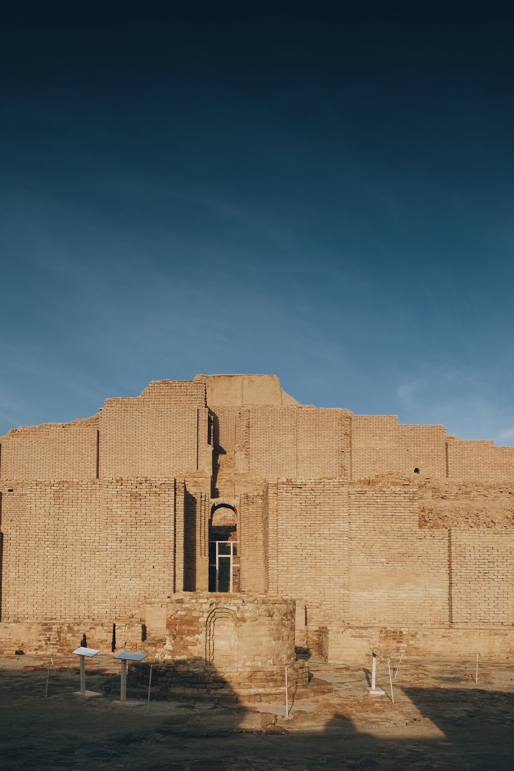 brown concrete building under blue sky during daytime