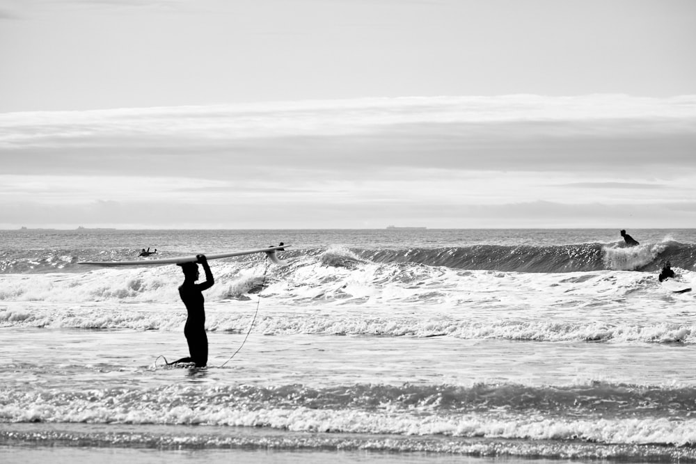 person surfing on sea waves during daytime