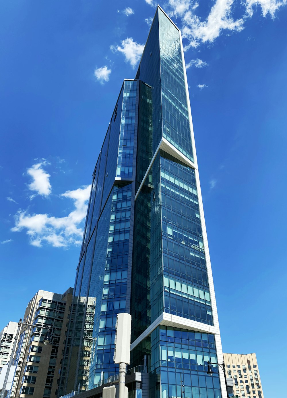 blue and white concrete building under blue sky during daytime