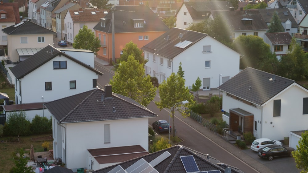 an aerial view of a residential neighborhood with solar panels on the roof