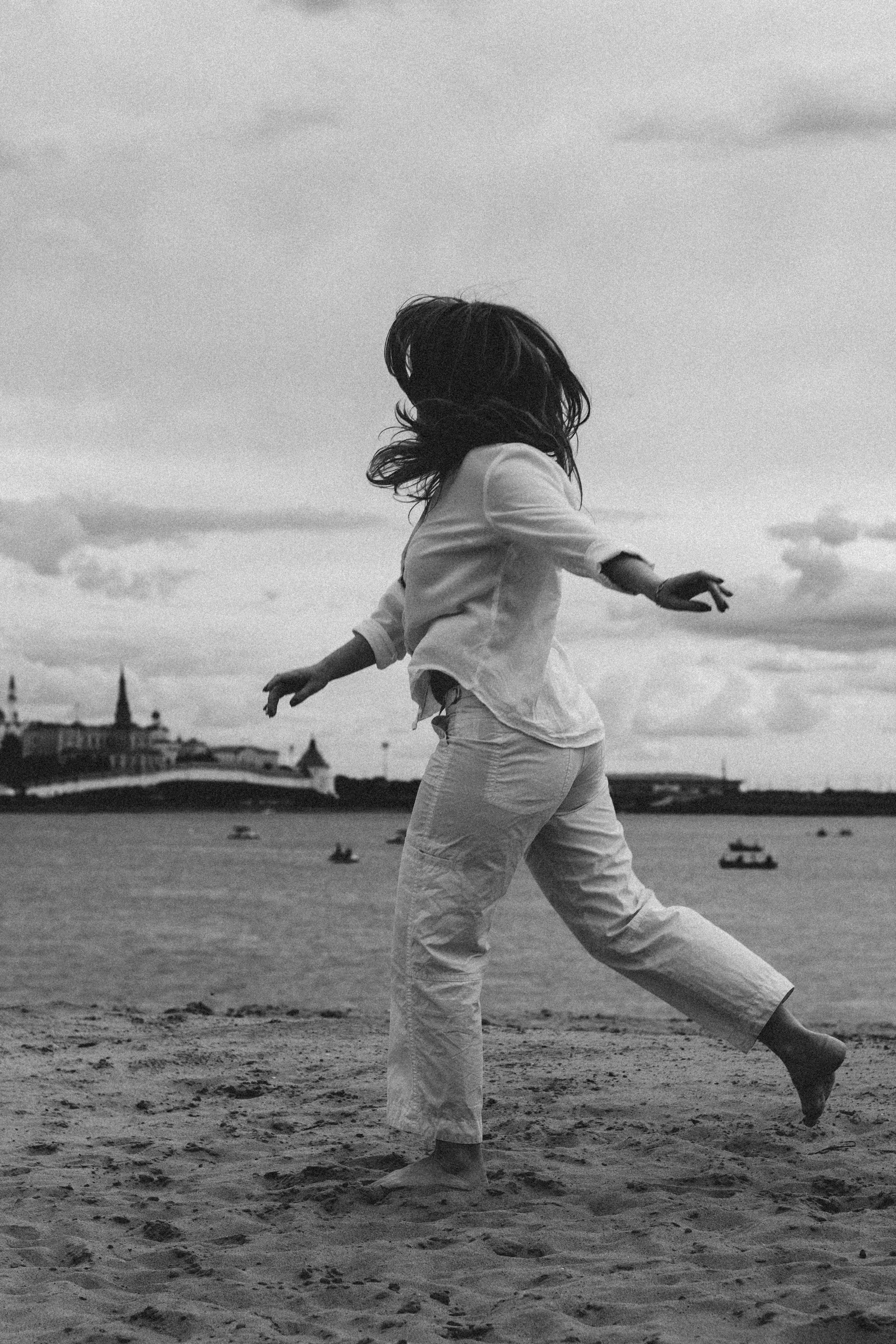 grayscale photo of girl in white shirt and pants