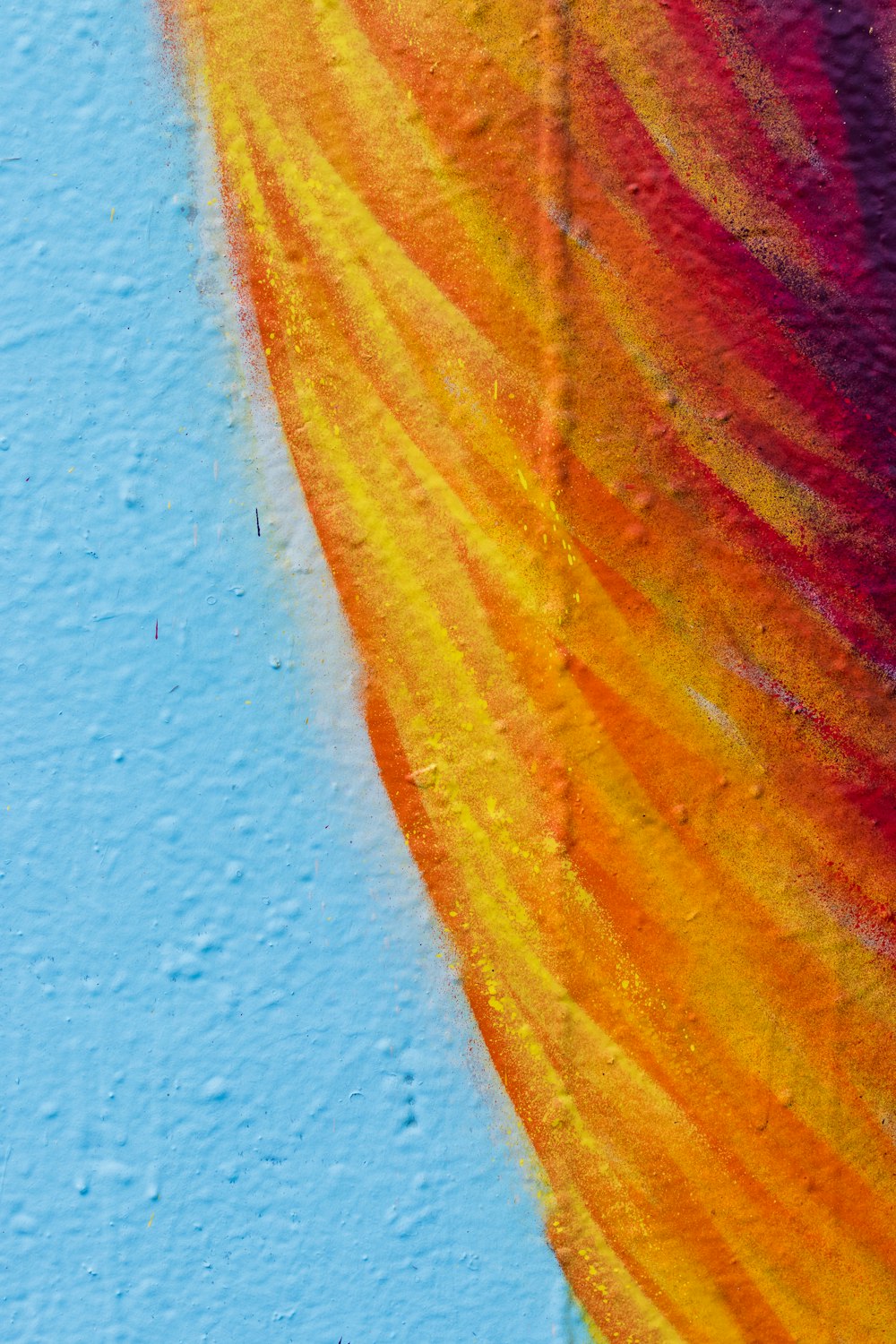 yellow and red textile beside white wall