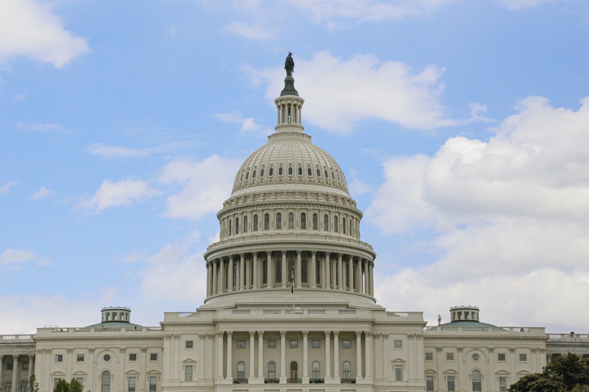 United States Capitol Building under blue sky in Washington D.C. representing Congressional budget and federal debt projections