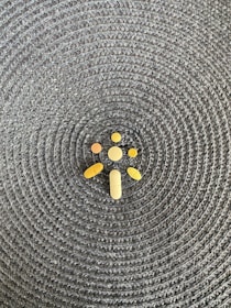 A close-up of various antibiotic pills arranged on a wooden surface.